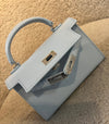 Sac à main bleu bébé