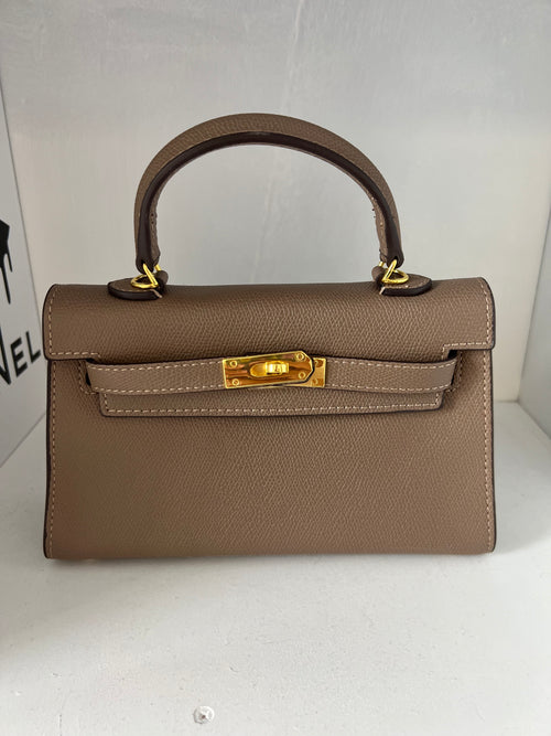 Sac taupe détails or